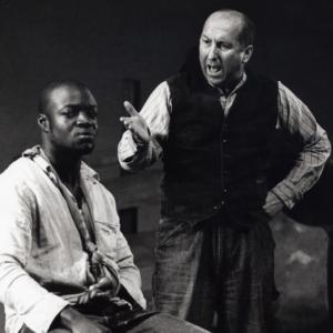 Enoch Frost as Tom Robinson and John Biggins as Prosecutor Gilmer in a Theatre Clewyd production of 'To Kill a Mockingbird'.