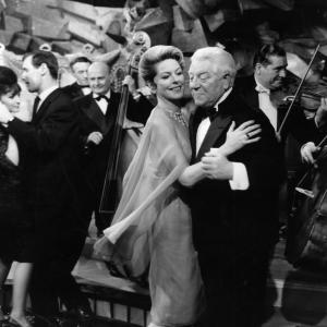 Still of Jean Gabin and Madeleine Robinson in The Gentleman from Epsom 1962