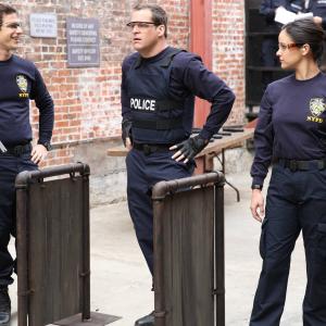 Still of Melissa Fumero, Kyle Bornheimer and Andy Samberg in Brooklyn Nine-Nine (2013)