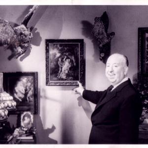 Alfred Hitchcock on set with a painting by Jaroslav Gebr