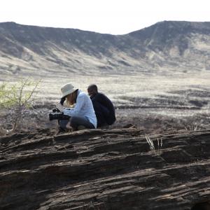 Lake Turkana Northern Kenya with camera assistant shooting archaeological dig site.