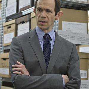 Still of Adam Godley in Suits 2011