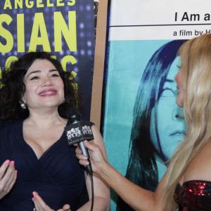 (L to R) Actress Karen-Eileen Gordon being interviewed by Dawna Lee Heising for MoreHorror.com and Eye On Entertainment, at the Los Angeles Asian Pacific Film Festival (Directors Guild of America)
