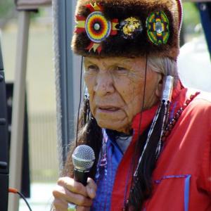 Saginaw Grant speaks to the crowd at the Eagle & Condor Pow Wow in Ontario, CA