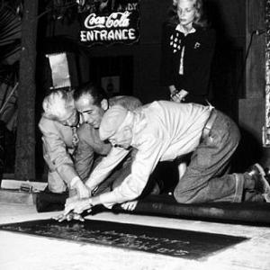 Humphrey Bogart Lauren Bacall and Sid Grauman circa 1946