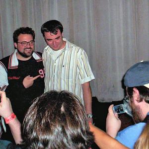 Duane Graves (Up Syndrome) accepts the grand jury prize from Kevin Smith (Clerks, Chasing Amy) at the 2006 Movies Askew Awards in Los Angeles, California.