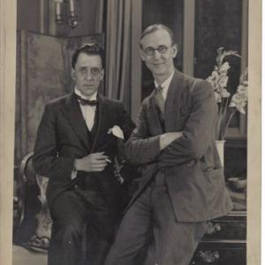 Edwin Greenwood standing on the right wearing glasses with unknown man