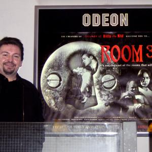 Jim alongside the Room 36 poster inside the Odeon Panton Street off Londons Leicester Square where it ran for two weeks
