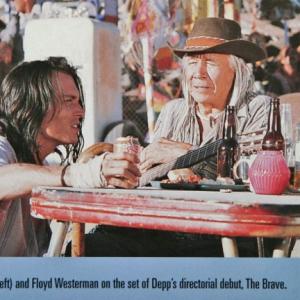 Johnny Depp giving direction to Floyd Redcrow Westerman, on the set of The Brave directed by Johnny Depp.