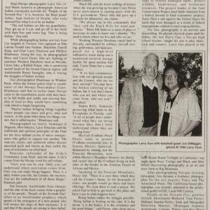 Article about Photographer Larry Gus with photograph of the photographer next to baseball great Joe DiMaggio