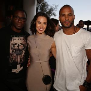 SUPERGIRLs David Harewood and THE 100s Ricky Whittle flanking Kristen Gutoskie from CONTAINMENT at Warner Bros Televisions ComicCon cocktail media mixer at the Hard Rock Hotels FLOAT Rooftop Bar on Friday July 10 2015