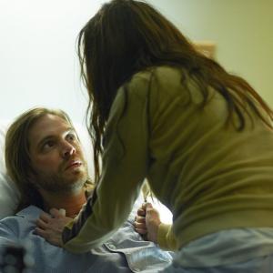 Still of Emily Hampshire and Aaron Stanford in 12 Monkeys 2015