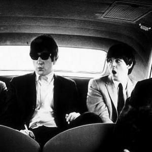 The Beatles Ringo Starr John Lennon Paul McCartney and George Harrison inside the car in Denver Co c 1964
