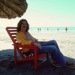 George Harrison in Acapulco enjoying the shade on the beach January 1977