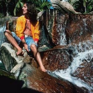 George Harrison on the watery rocks in Acapulco January 1977