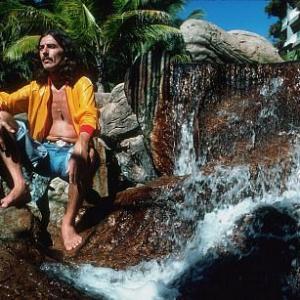 George Harrison on the watery rocks in Acapulco, January 1977