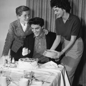 Elvis Presley with Dolores Hart and Valerie Allen at an Army Bond farewell party given by Hal Wallis during the making of King Creole 03121958