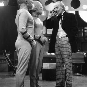 William Hartnell as Dr Who peers through his monocle at two extraterrestrials during filming of the popular science fiction series Dr Who at the BBCs Shepherds Bush Studios in London