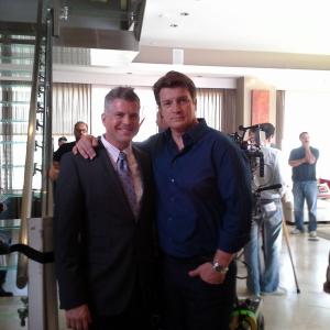 Jesse Henecke and Nathan Fillion on the set of CASTLE