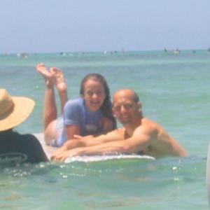 Hallee Hirsh with Anthony Edwards Behind the Scenes getting ready to shoot surfing scene in On the Beach 2002