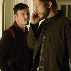 Still of Kris Holden-Ried and Paul Amos in Lost Girl (2010)