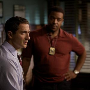 Still of Russell Hornsby and Sasha Roiz in Grimm 2011