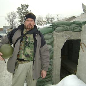 Filmmaker Anthony Hornus in front of the Hotel California complete with mortar and missle bunker at Bagram Air Field Afghanistan while filming Outside the Wire The Forgotten Children of Afghanistan