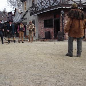 Actors Anthony Hornus Bill McKinney Renee O Connor and Tommy Dippel are confronted by Herbert Cowboy Coward Deliverance in a scene from Ghost Town filmed in Maggie Valley North Carolina