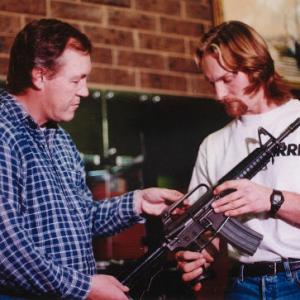 John Fox with Action Film Director Brent Houghton looking at the 556mm Colt M16A1 Carbine with short 12 barrel as a possible hero gun for his film Huntsman 51 1999