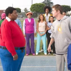 Arthur (J. Mack Slaughter, Jr. right) confronts Fat Albert (Kenan Thompson) on the track. Observing in the background are (L-R) Mushmouth (Jermaine Williams), Dumb Donald (Marques B. Houston), Rudy (Shedrack Anderson III), Lauri (Dania Ramirez), Old Weird Harold (Aaron A. Frazier), Doris (Kyla Pratt) and Bucky (Alphonso McAuley).