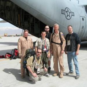 Spencer Humm poses with a USAF C130 crew in Bagram Afghanistan during the shooting of the comedy documentary Operation Swashbuckle 2004