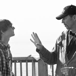 Iliff directing Ryan Donowho on set in Isla Vista filming Rites of Passage