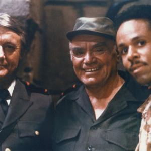 Robert Vaughn Ernest Borgnine and Leon Isaac Kennedy on the set of Skeleton Coast
