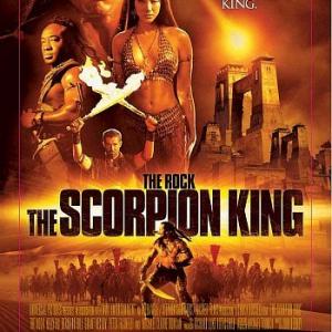 Steven Brand as Memnon holds the flaming swords in a publicity poster for The Scorpion King