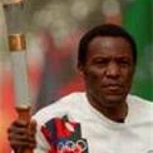 Rafer Johnson carries 1984 Olympic torch