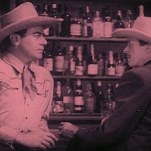 I Stanford Jolley and James Newill in Guns of the Law 1944
