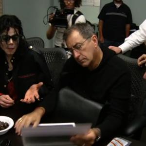 Michael Jackson Kenny Ortega and Bruce Jones reviewing story boards during prep for the This is It 3D movies  directed by Bruce Jones for the concert tour