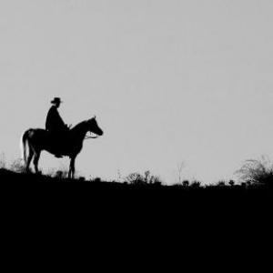 Greg Joseph in silhouette on horseback as The Soulless Gunfighter in Cowboy Dreams with Danny Trejo and Bill Engvall