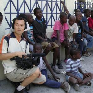 Young Man Kang DirectorProducer of YMK Films with Haitian Street Kids in PortauPrince Haiti 01012009
