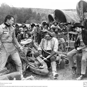 Still of John Wayne, Ian Keith, Tyrone Power Sr. and Charles Stevens in The Big Trail (1930)