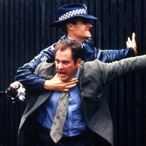 Still from BLUE HEELERS Jeremy Kewley as Tony Timms William McInnes as Senior Constable Nick Schultz
