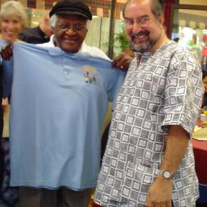 Presenting Archbishop Desmond Tutu with a Three Amigos shirt