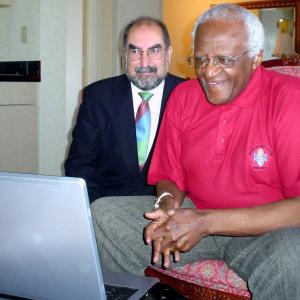 Firdaus Kharas with Archbishop Desmond Tutu