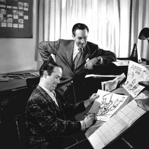 Walt Disney with Ward Kimball working on the animation and character design for Alice in Wonderland c 1949