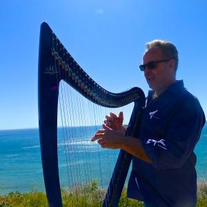 Chris Kinkade playing his Blue Electric Camac harp Lulu on the set of SpaTrek