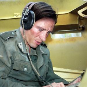 Hans Markus Kirschbaum writes a letter to his mother while out on tank patrol