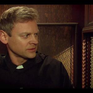 Father Oliver in 'A Match Made In Heaven'