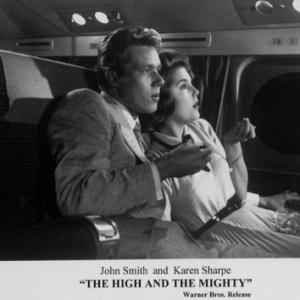 Karen Sharpe and John Smith star as newlyweds Nell and Milo Buck in The High and the Mighty