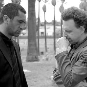 Wayne Kramer directs Cliff Curtis on the set of CROSSING OVER.