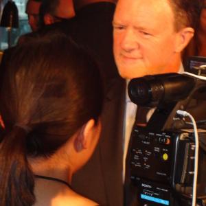 Mark Lamprell on the red carpet for the premiere of Goddess